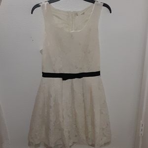 White dress with a black bow